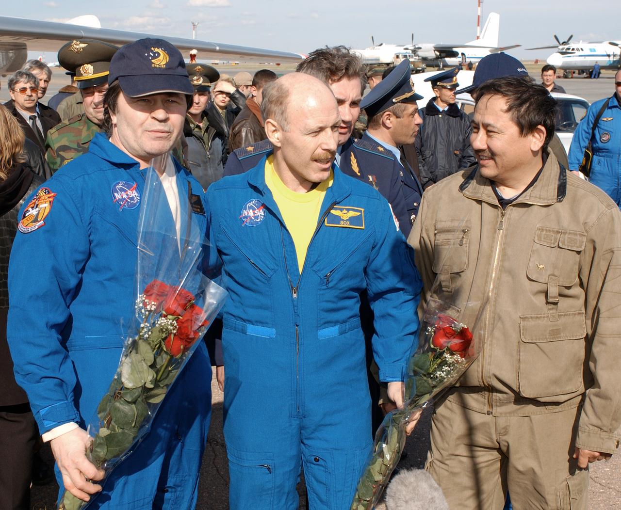 May 4, 2003, Astana, Kazakhstan.  Expedition Six Commander Ken Bowersox (C), Flight Engineer Nikolai Budarin (L) and NASA ISS Science Officer Don Pettit (not pictured) are welcomed to Kazakhstan by Cosmonaut Talgat Musabayev. The Expedition Six Soyuz capsule landed in Kazakhstan.  Photo Credit: "NASA/Bill Ingalls"