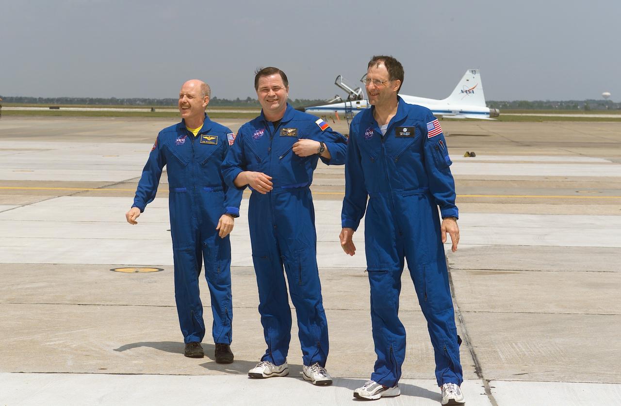 JSC2003-E-37639 (21 May 2003) --- The Expedition 6 crewmembers are pictured following their arrival at Ellington Field, near Johnson Space Center (JSC). From the left are astronaut Kenneth D. Bowersox, mission commander; cosmonaut Nikolai M. Budarin, flight engineer representing Rosaviakosmos; and astronaut Donald R. Pettit, NASA ISS science officer.