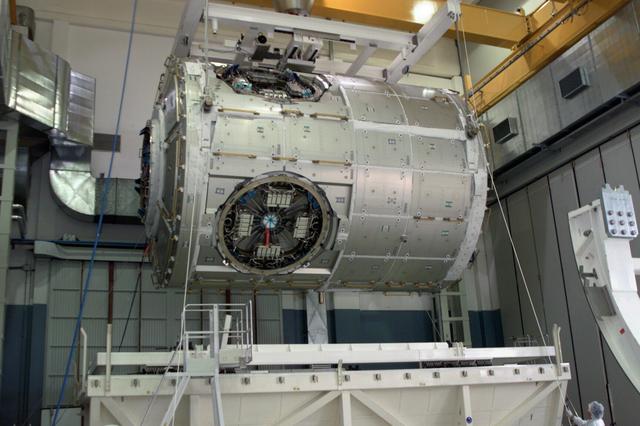 JSC2003-E-40245 (28 May 2003) --- The International Space Station Node 2 module is lowered into an environmentally controlled container in preparation for its transportation to the United States. An Airbus Beluga heavy-lift aircraft carrying Node 2 departed May 30 from Turin, Italy where the Italian Space Agency's (ASI) contractor, Alenia Spazio, leading a consortium of European companies, built it. The module was built for NASA under a barter agreement with the European Space Agency (ESA) in exchange for the launch of the European Columbus Laboratory by the space shuttle to the International Space Station. Node 2 will provide a passageway between four International Space Station science experiment modules: the U.S. Destiny Laboratory, the Kibo Japanese Experiment Module, the European Columbus Laboratory and the Centrifuge Accommodation Module.  The addition of Node 2 to the station will signify the U.S. Core Complete stage of assembly, at which time the station can support the addition of international laboratories from Europe and Japan.     Photo Credit: NASA