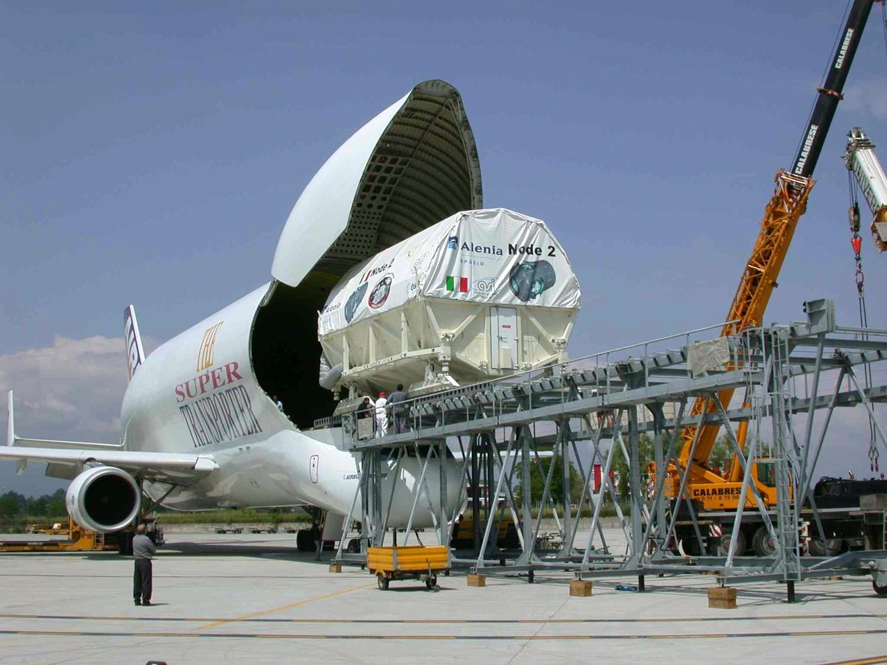 JSC2003-E-40249 (30 May 2003) --- The International Space Station U.S. Node 2 module is placed into an Airbus Beluga heavy-lift aircraft.  The aircraft departed May 30 from Turin, Italy and arrived at the Kennedy Space Center June 1 with Node 2.  Under contract of the Italian Space Agency (ASI), Alenia Spazio led a consortium of European sub-contractors to build Node 2. The module was built for NASA under a barter agreement with the European Space Agency (ESA) in exchange for the launch of the European Columbus Laboratory by the space shuttle to the International Space Station.  Node 2 will provide a passageway between four International Space Station science experiment modules: the U.S. Destiny Laboratory, the Kibo Japanese Experiment Module, the European Columbus Laboratory and the Centrifuge Accommodation Module.  The addition of Node 2 to the station will signify the U.S. Core Complete stage of assembly, at which time the station can support the addition of international laboratories from Europe and Japan. Photo Credit: Italian Space Agency (ASI)