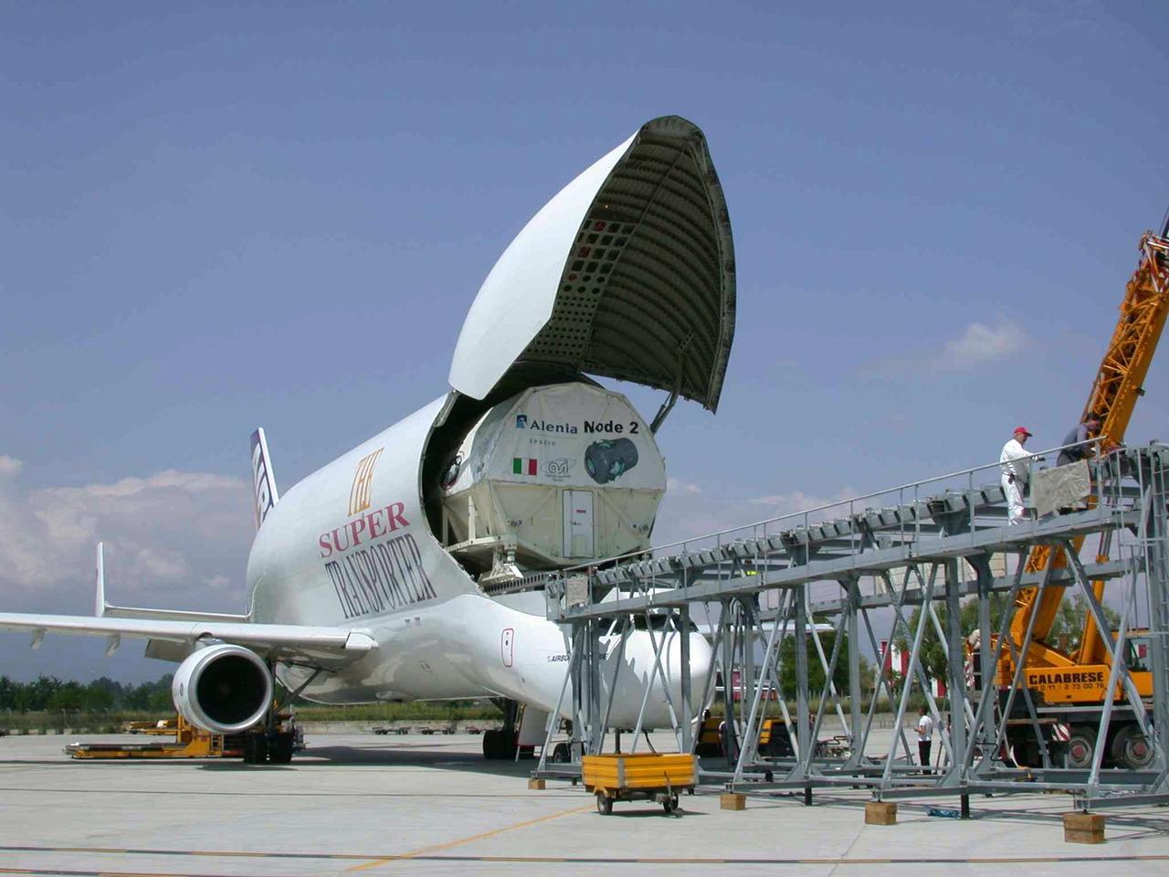 JSC2003-E-40250 (30 May 2003) ---  The International Space Station U.S. Node 2 module is placed into an Airbus Beluga heavy-lift aircraft.  The aircraft departed May 30 from Turin, Italy and arrived at the Kennedy Space Center June 1 with Node 2.  Under contract of the Italian Space Agency (ASI), Alenia Spazio led a consortium of European sub-contractors to build Node 2. The module was built for NASA under a barter agreement with the European Space Agency (ESA) in exchange for the launch of the European Columbus Laboratory by the space shuttle to the International Space Station.  Node 2 will provide a passageway between four International Space Station science experiment modules: the U.S. Destiny Laboratory, the Kibo Japanese Experiment Module, the European Columbus Laboratory and the Centrifuge Accommodation Module.  The addition of Node 2 to the station will signify the U.S. Core Complete stage of assembly, at which time the station can support the addition of international laboratories from Europe and Japan. Photo     Credit:  Italian Space Agency (ASI)