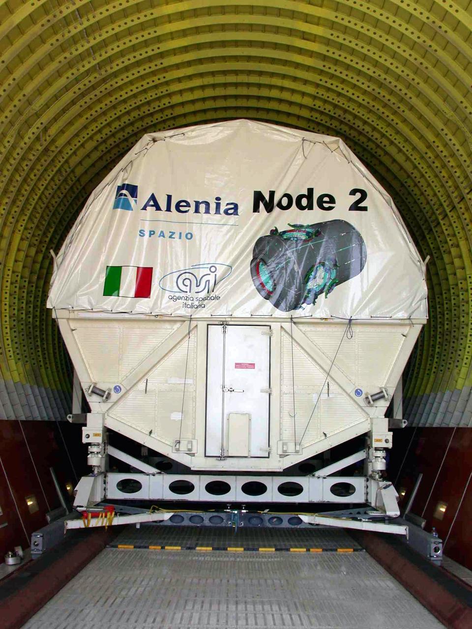 JSC2003-E-40252 (30 May 2003) --- The International Space Station U.S. Node 2 module is pictured shortly after being placed into an Airbus Beluga heavy-lift aircraft.  The aircraft departed May 30 from Turin, Italy and arrived at the Kennedy Space Center June 1 with Node 2.  Under contract of the Italian Space Agency (ASI), Alenia Spazio led a consortium of European sub-contractors to build Node 2. The module was built for NASA under a barter agreement with the European Space Agency (ESA) in exchange for the launch of the European Columbus Laboratory by the space shuttle to the International Space Station.  Node 2 will provide a passageway between four International Space Station science experiment modules: the U.S. Destiny Laboratory, the Kibo Japanese Experiment Module, the European Columbus Laboratory and the Centrifuge Accommodation Module.  The addition of Node 2 to the station will signify the U.S. Core Complete stage of assembly, at which time the station can support the addition of international laboratories from Europe and Japan.  Photo Credit: Italian Space Agency (ASI)