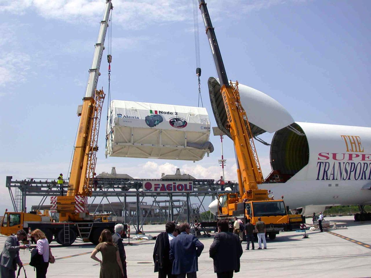JSC2003-E-40265 (30 May 2003) --- The International Space Station U.S. Node 2 module is hoisted into an Airbus Beluga heavy-lift aircraft.  The aircraft departed May 30 from Turin, Italy and arrived at the Kennedy Space Center June 1 with Node 2. Under contract of the Italian Space Agency (ASI), Alenia Spazio led a consortium of European sub-contractors to build Node 2. The module was built for NASA under a barter agreement with the European Space Agency (ESA) in exchange for the launch of the European Columbus Laboratory by the space shuttle to the International Space Station. Node 2 will provide a passageway between four International Space Station science experiment modules: the U.S. Destiny Laboratory, the Kibo Japanese Experiment Module, the European Columbus Laboratory and the Centrifuge Accommodation Module.  The addition of Node 2 to the station will signify the U.S. Core Complete stage of assembly, at which time the station can support the addition of international laboratories from Europe and Japan. Photo  Credit: Italian Space Agency (ASI)