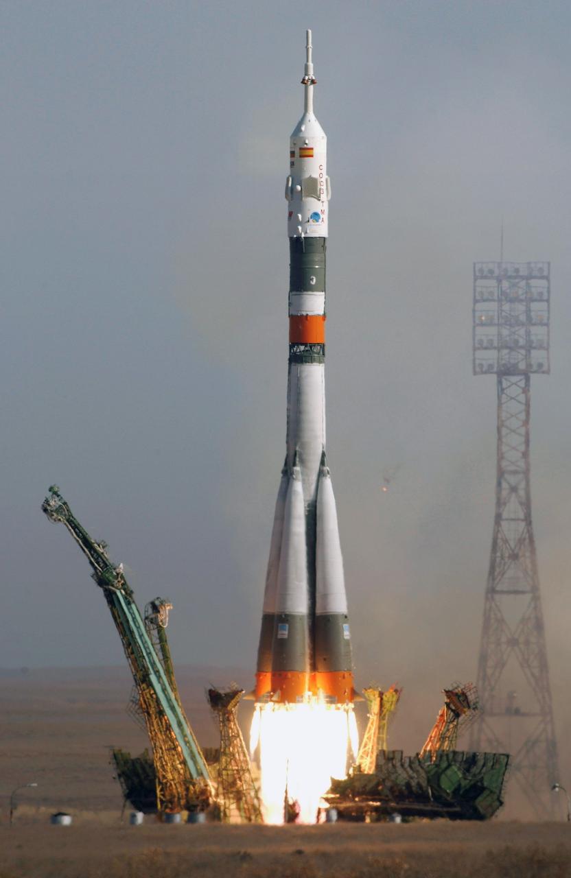 JSC2003-E-59221 (18 October 2003) --- The Soyuz TMA-3 vehicle launches from the Baikonur Cosmodrome in Kazakhstan October 18, 2003, carrying astronaut C. Michael Foale, Expedition 8 commander and NASA ISS science officer; cosmonaut Alexander Kaleri, Soyuz commander and flight engineer, representing Rosaviakosmos; and European Space Agency (ESA) astronaut Pedro Duque of Spain to the International Space Station (ISS). The trio will arrive at the ISS October 20, as Foale and Kaleri take over command of Station operations for the next 6 1/2 months. Duque will return to Earth October 28 with cosmonaut Yuri Malenchenko, Expedition 7 commander, representing Rosaviakosmos, and astronaut Ed Lu, NASA ISS science officer, in another Soyuz capsule already docked to the ISS. Photo Credit: "NASA/Bill Ingalls"