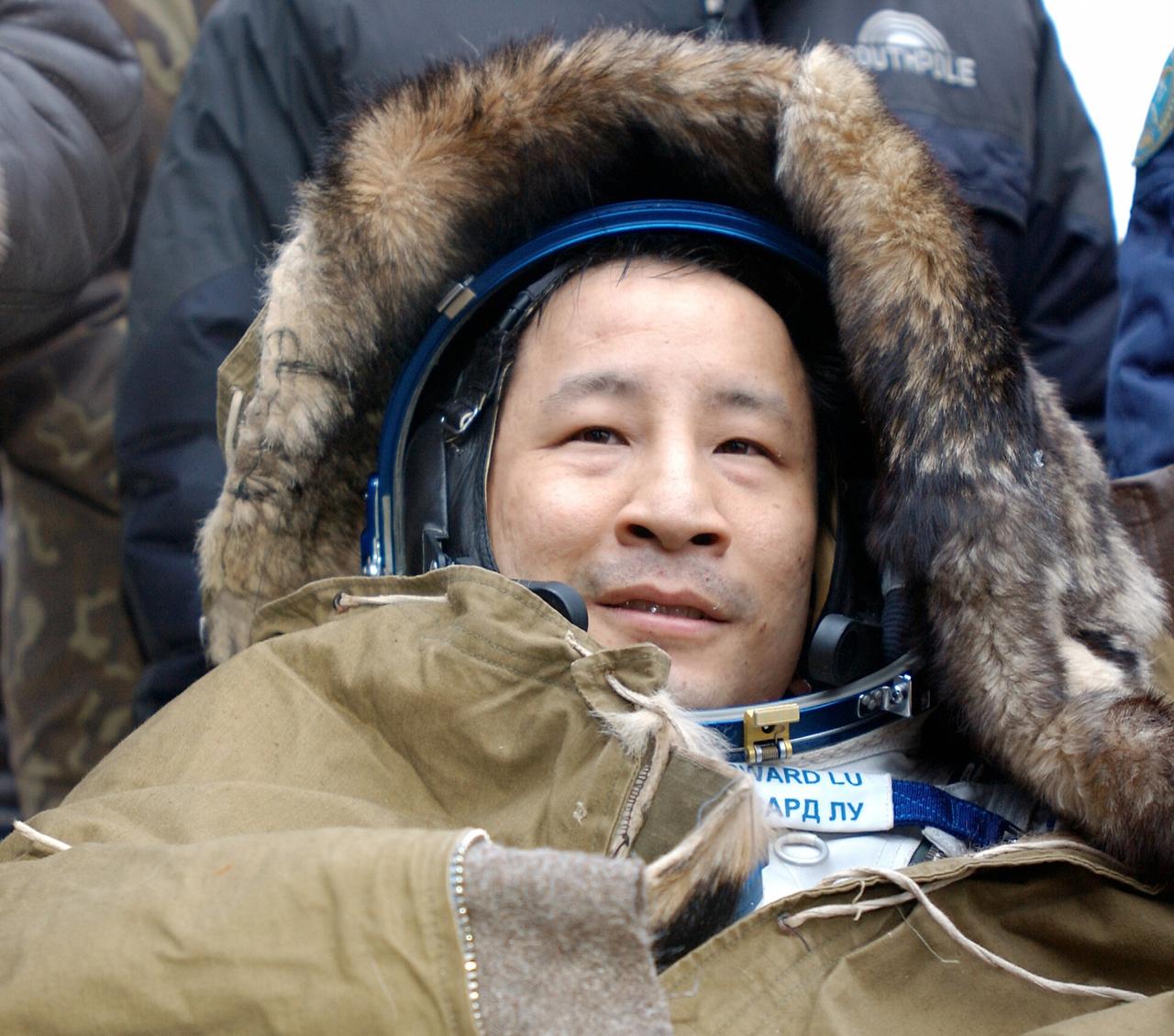 JSC2003-E-61407 (28 October 2003) --- Astronaut Edward T. Lu, Expedition 7 NASA ISS science officer and flight engineer, smiles while resting in a chair after landing in the Soyuz TMA-2 spacecraft in Kazakhstan on October 27, 2003 at 9:41 p.m. (EST). Photo Credit: NASA/Bill Ingalls