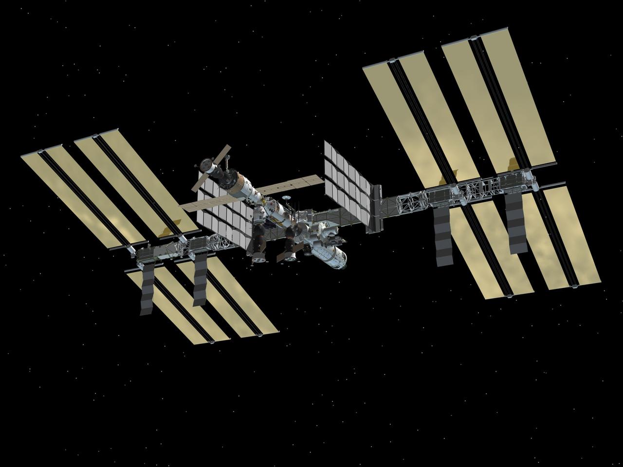 JSC2003-E-64497 (December 2003) - Under/aft side view of the International Space Station after the installment of Node 2 during the STS-120/10A assembly mission.  The addition of Node 2 signifies the US Core Complete stage of assembly, at which time the station can support the addition of international laboratories from Europe and Japan.