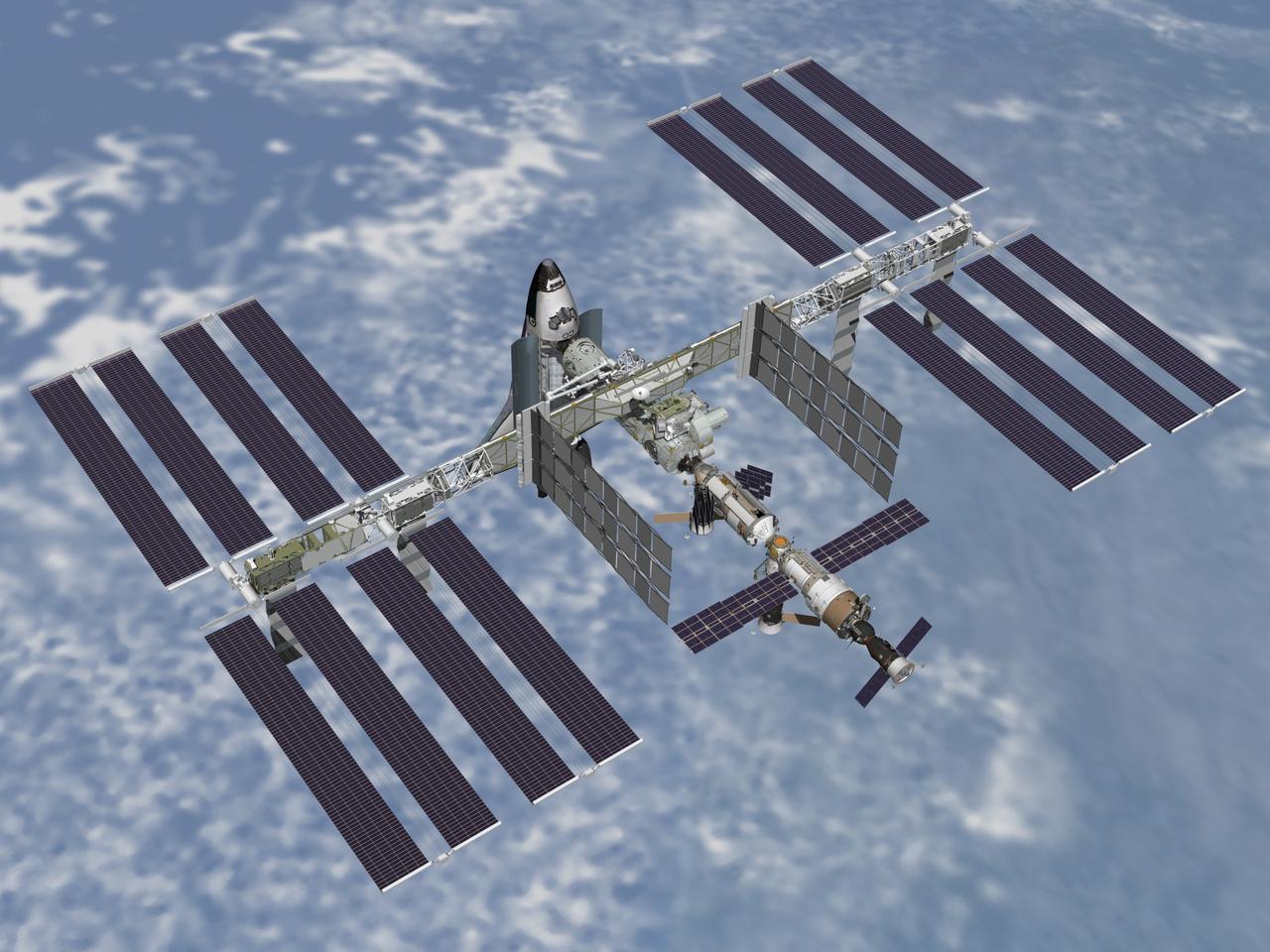 JSC2003-E-64500  (December 2003) - Post 10A aft view of the International Space Station with Shuttle docked to Node 2.