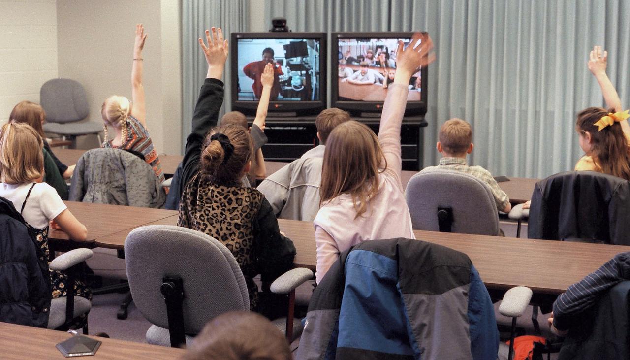 JSC2004E14751 --- Students interface with NASA via the Digital Learning Network. A classroom representative can directly communicate audibly and visibly with the NASA Education Specialist.