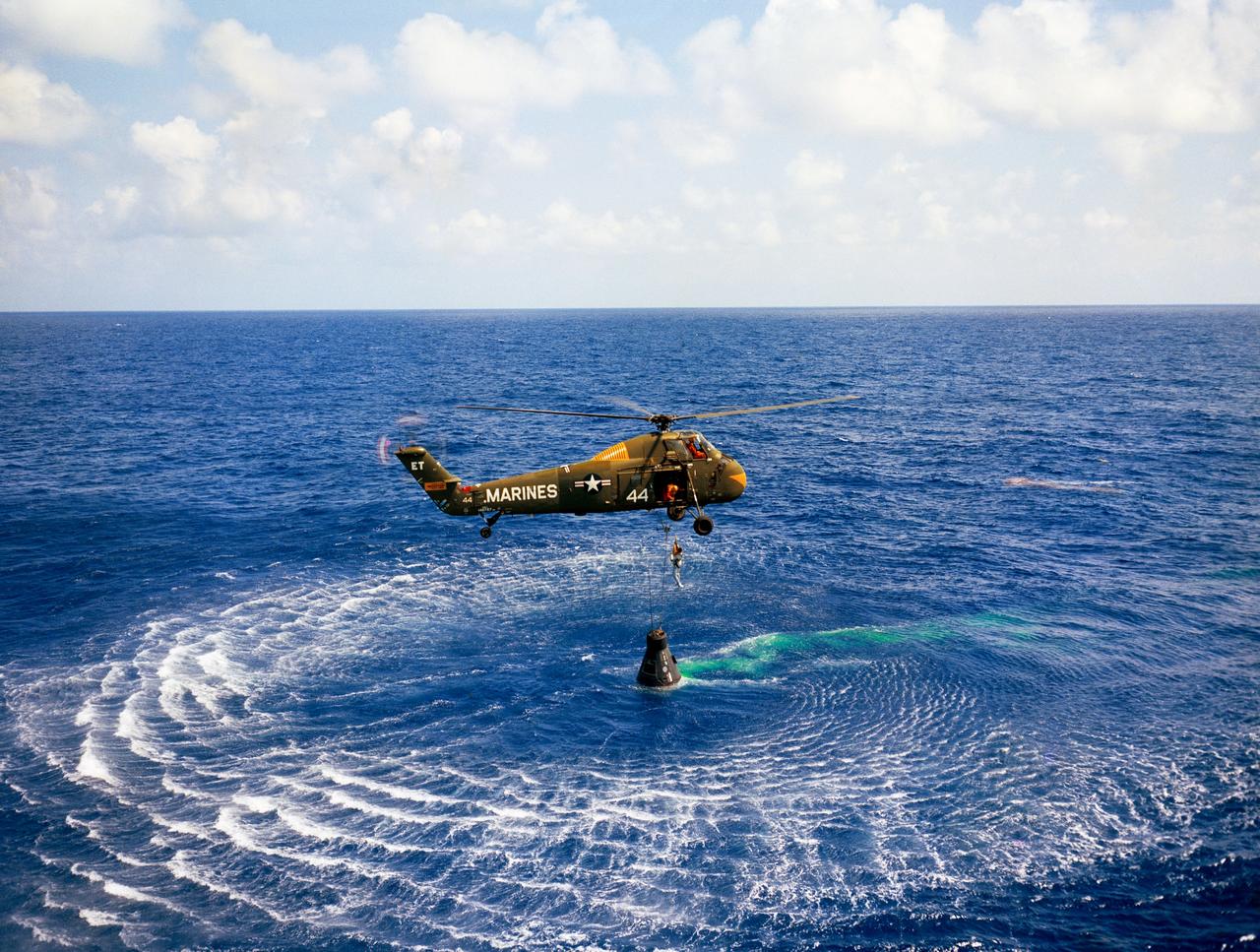 JSC2004-E-19882 (5 May 1961) --- Astronaut Alan B. Shepard Jr. is rescued by a U.S. Marine helicopter at the termination of his suborbital flight May 5, 1961, down range from the Florida eastern coast. Photo credit: NASA