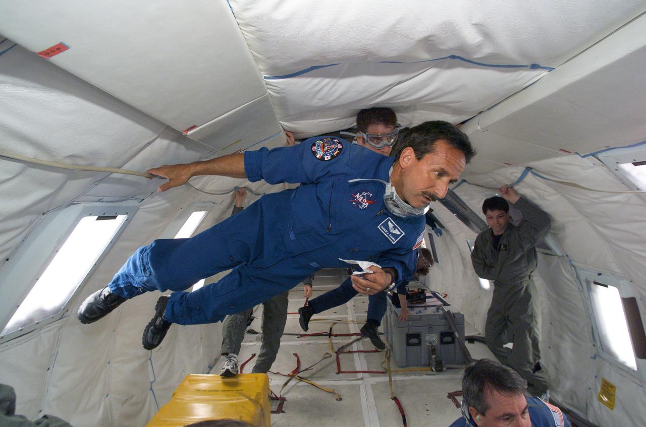 JSC2004-E-24534 (1 June 2004) --- Astronaut Charles J. Camarda, STS-114 mission specialist, participates in Return to Flight training aboard NASA’s KC-135 aircraft. The aircraft, based at Ellington Field near Johnson Space Center (JSC), frequently flies a series of parabola patterns over the Gulf of Mexico to afford opportunities for astronauts and investigators to experience brief periods of weightlessness.