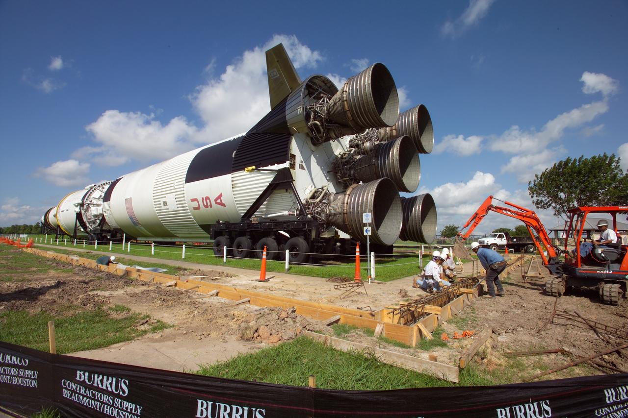 With a Smithsonian Grant,the Saturn V rocket is being restored. Developing rocket park is part of the plan as well. Views of the park being built and the rocket being prepped for clean up.