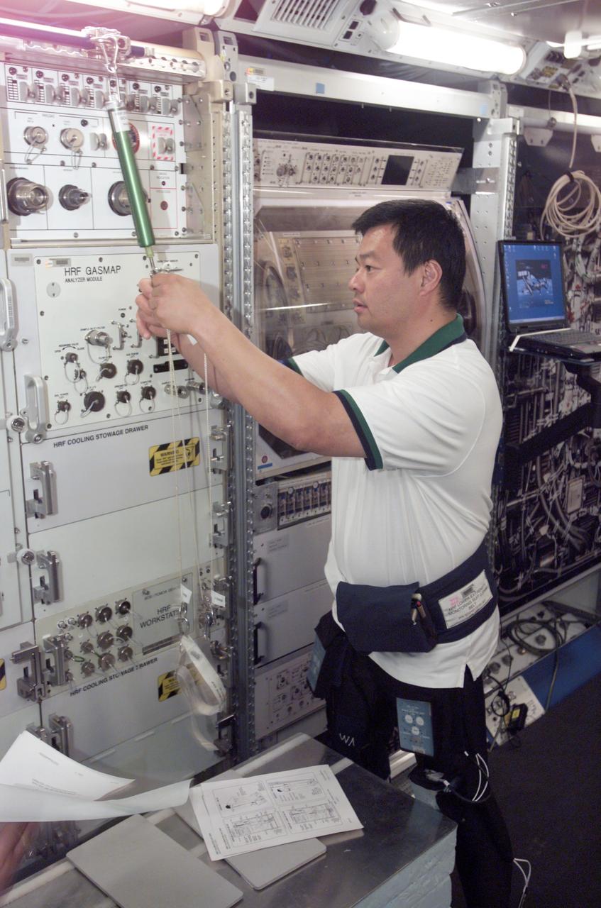 JSC2004-E-35439 (11 August 2004) --- Astronaut Leroy Chiao, Expedition 10 commander and NASA ISS science officer, participates in Foot/Ground Reaction Forces During Spaceflight (FOOT) Integrated nominal operations during Human Research Facility (HRF) training in the International Space Station (ISS) Destiny laboratory mockup/trainer at Johnson Space Center’s Space Vehicle Mockup Facility.