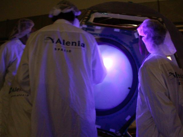 JSC2004-E-42740 (August 2004) --- Engineers and technicians check the International Space Station's Cupola in the Alenia Spazio clean room in Turin, Italy. Personnel are preparing the hardware for shipment to NASA's launch facility at Cape Kennedy, Florida.  From inside the Cupola, a dome-shaped module with seven windows, astronauts have a panoramic view for observing operations on the outside of the orbiting complex. The Cupola module provides external observation capabilities during spacewalks, docking operations, hardware surveys and for Earth and celestial studies. It also serves as the primary location for executing robot arm operations of Canadarm2. Until the Cupola is installed, crews have been using a robotic control computer station located in the Destiny Laboratory to operate the arm. The Cupola&#0146;s  windows enhance the robotic arm operator's situational awareness, supplementing camera and graphic views provided by the computer workstation. Photo Credit: Alenia Spazio