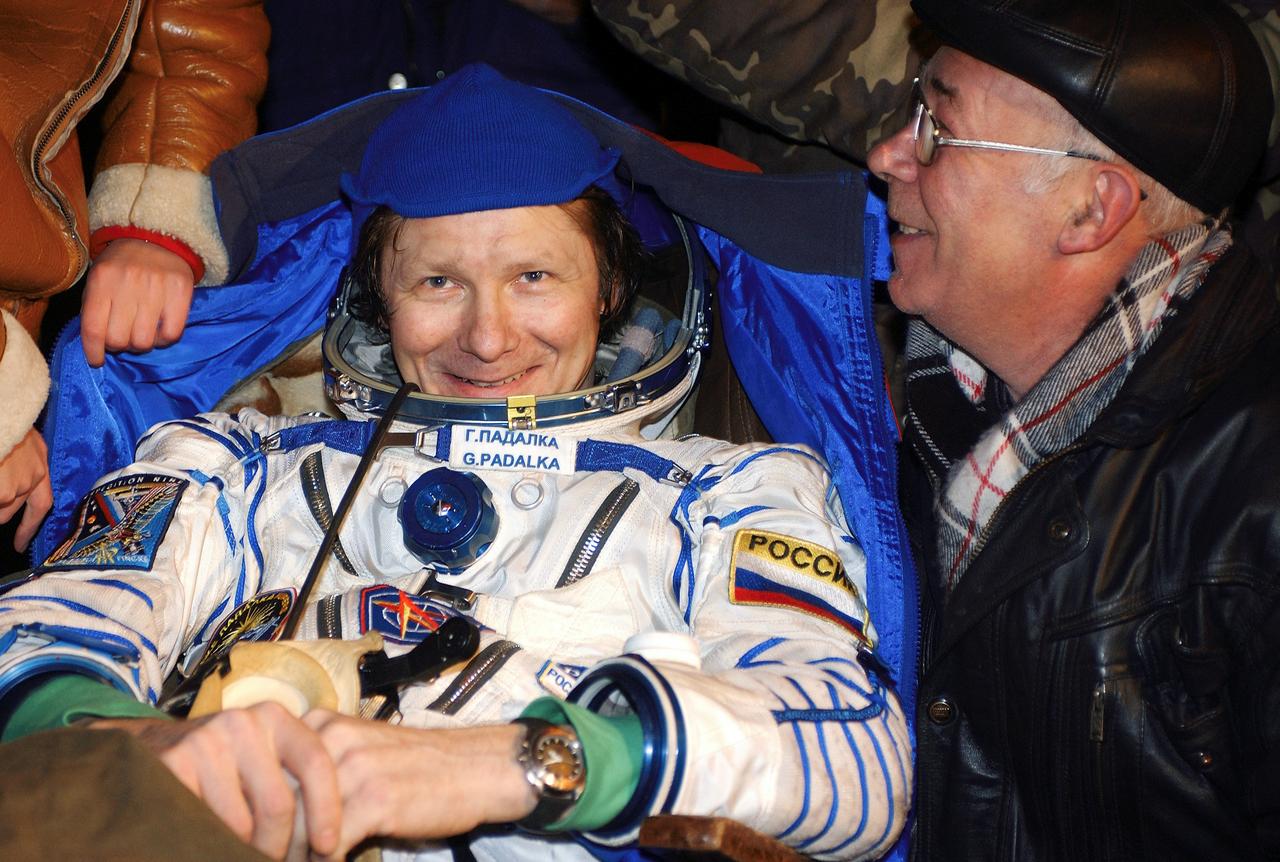 JSC2004-E-47549 (24 October 2004) --- Cosmonaut Gennady I. Padalka, Russia&#0146;s Federal Space Agency Expedition 9 commander, smiles after the successful landing in the Soyuz spacecraft with fellow crew members astronaut Edward M. (Mike) Fincke, NASA International Space Station (ISS) science officer and flight engineer, and Russian Space Forces cosmonaut Yuri Shargin. The crew landed approximately 85 kilometers northeast of Arkalyk in northern Kazakhstan on October 24, 2004.  Photo Credit: "NASA/Bill Ingalls"