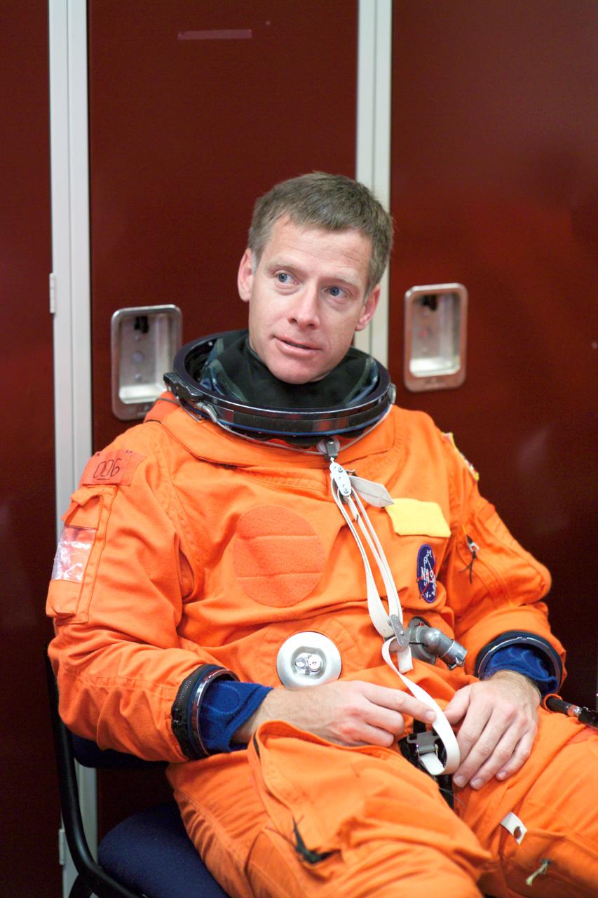 JSC2005-E-13772 (5 April 2005) --- Astronaut Christopher J. Ferguson, STS-115 pilot, attired in a training version of the shuttle launch and entry suit, awaits the start of an emergency egress training session in the Space Vehicle Mockup Facility at the Johnson Space Center.