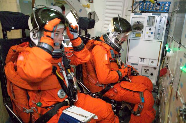 NASA image: STS-115 crew during crew bailout (91020) training in crew compartment trainer.