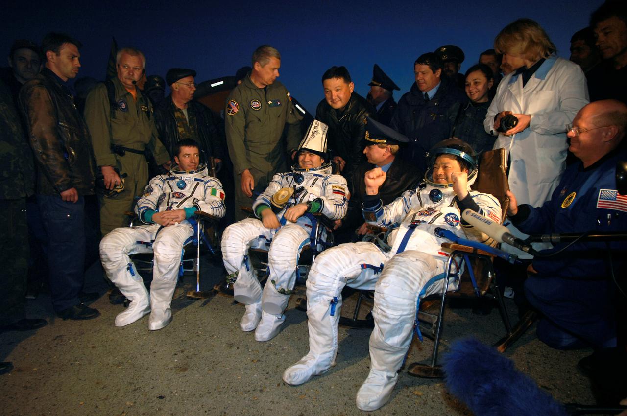 JSC2005-E-17948 (25 April 2005) --- Astronaut Leroy Chiao (right), Expedition 10 commander and NASA ISS science officer; cosmonaut Salizhan S. Sharipov, flight engineer representing Russia's Federal Space Agency; and European Space Agency (ESA) astronaut Roberto Vittori of Italy are seated in their chairs after extraction from the Soyuz TMA-5 capsule. The pre-dawn landing occurred on April 25, 2005 (Kazakhstan time) northeast of the Kazakhstan town of Arkalyk to wrap up a six month mission aboard the International Space Station (ISS) for Chiao and Sharipov and a ten-day mission for Vittori. The twice-flown Italian astronaut participated under a commercial contract between ESA and the Russian Federal Space Agency. Photo Credit: NASA/Bill Ingalls