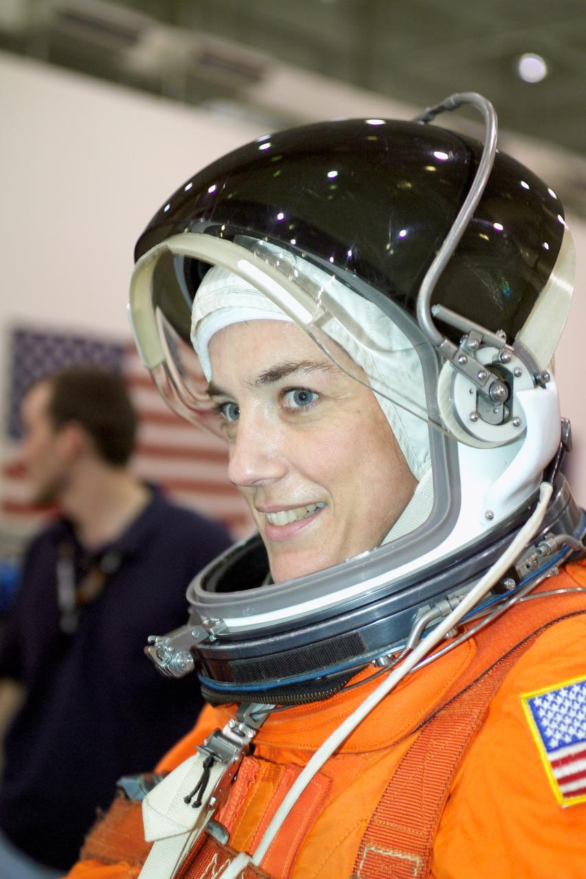 JSC2005-E-19183 (11 May 2005) --- Astronaut Heidemarie M. Stefanyshyn-Piper, STS-115 mission specialist, attired in a training version of the shuttle launch and entry suit, awaits the start of a water survival training session in the Neutral Buoyancy Laboratory (NBL) near Johnson Space Center.