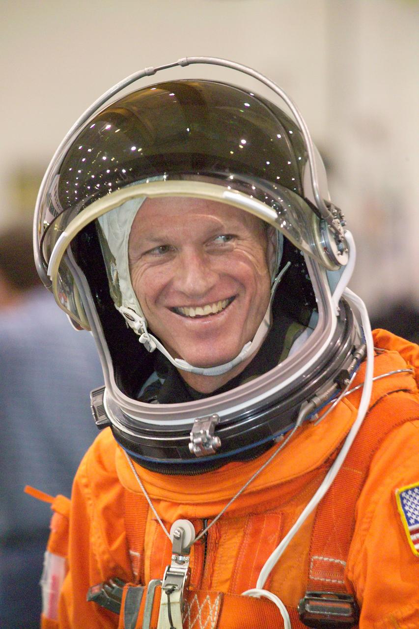 JSC2005-E-19222 (11 May 2005) --- Astronaut Brent W. Jett Jr., STS-115 commander, attired in a training version of the shuttle launch and entry suit, awaits the start of a water survival training session in the Neutral Buoyancy Laboratory (NBL) near Johnson Space Center.