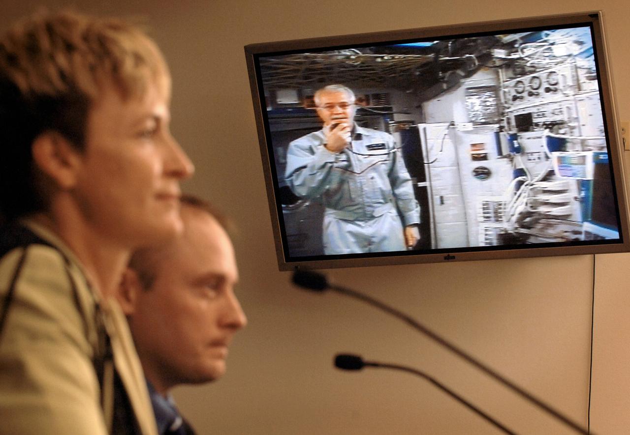 JSC2005-E-22365 (14 June 2005) --- Astronaut John L. Phillips, Expedition 11 NASA space station science officer and flight engineer, testifies via video screen before the House Subcommittee on Space and Aeronautics chaired by Rep. Ken Calvert (R-Calif.), as he orbited Earth onboard the international space station at a speed of five miles a second. Phillips was approximately 220 statute miles above Earth, but his radio transmissions were routed to a Tracking and Data Relay Satellite (TDRS) in geostationary orbit at an altitude of about 22,300 miles. Astronauts Peggy A. Whitson and Edward M. (Mike) Fincke, former station residents, are visible at left. Photo credit: NASA/Bill Ingalls.