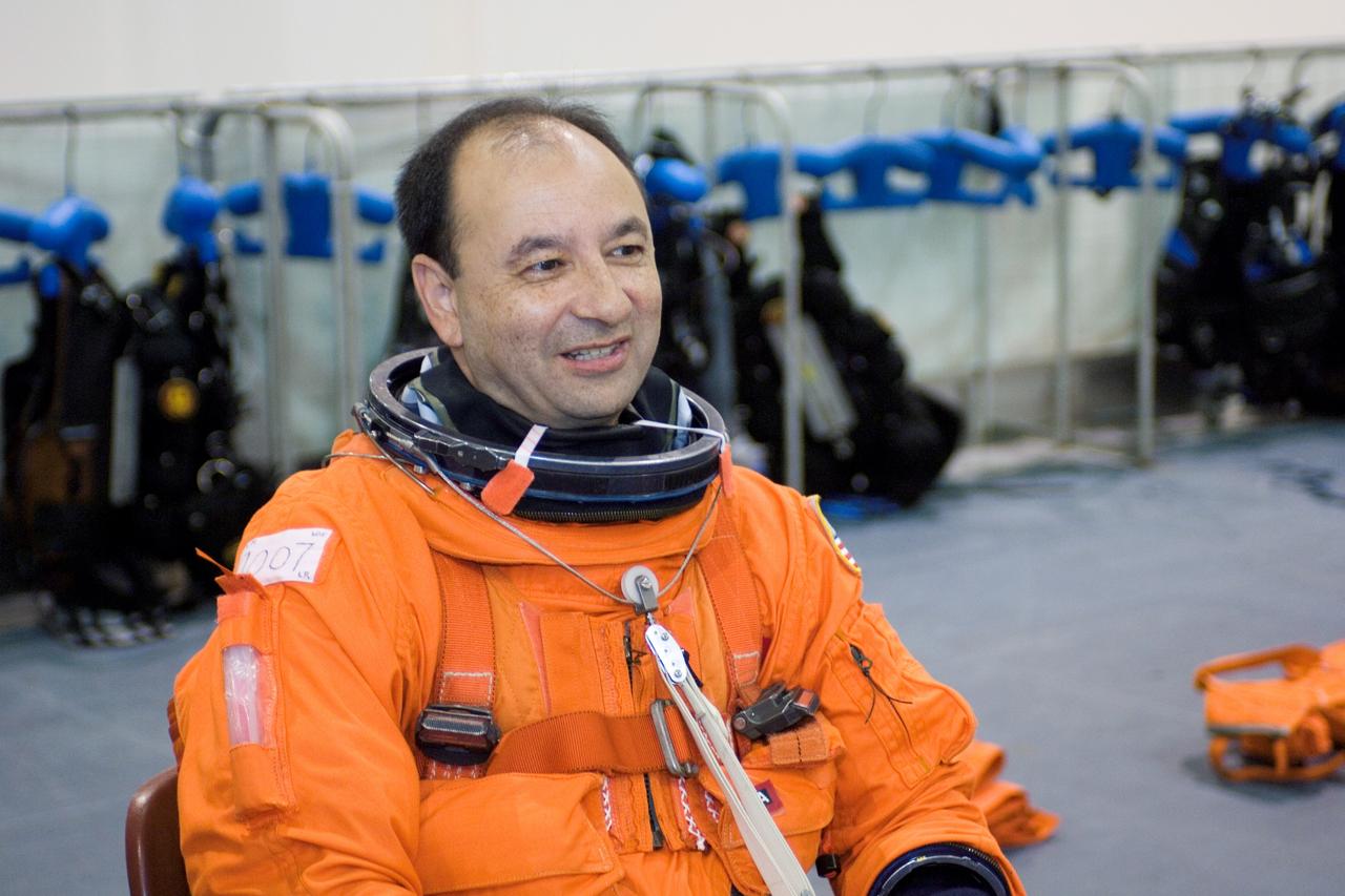 JSC2005-E-31226 (28 July 2005) --- Astronaut Mark L. Polansky, STS-116 commander, attired in a training version of the shuttle launch and entry suit, awaits the start of an emergency egress training session in the Neutral Buoyancy Laboratory (NBL) near the Johnson Space Center (JSC).
