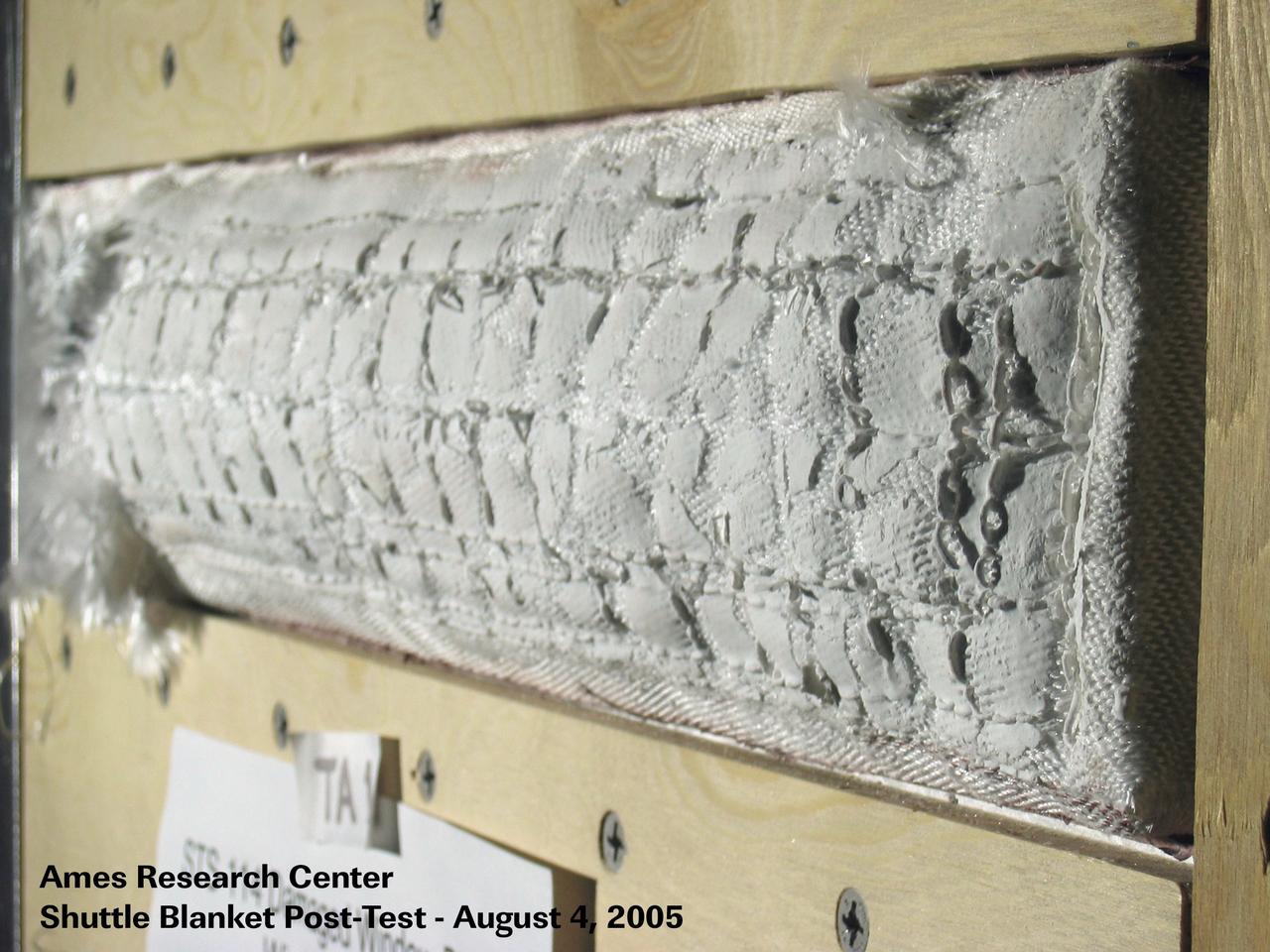JSC2005-E-32511 (4 August 2005) --- One of four visual aids used by  Shuttle Deputy Program Manager Wayne Hale during an August 4 press conference that dealt with important tests in wind tunnels at NASA's Ames Research Center. Engineers simulated the conditions of the Space Shuttle Discovery for a disrupted thermal blanket near the commander's window on the forward cabin of the spacecraft. Eventually it was decided that no additonal spacewalk work needed to be performed to  fix the blanket.