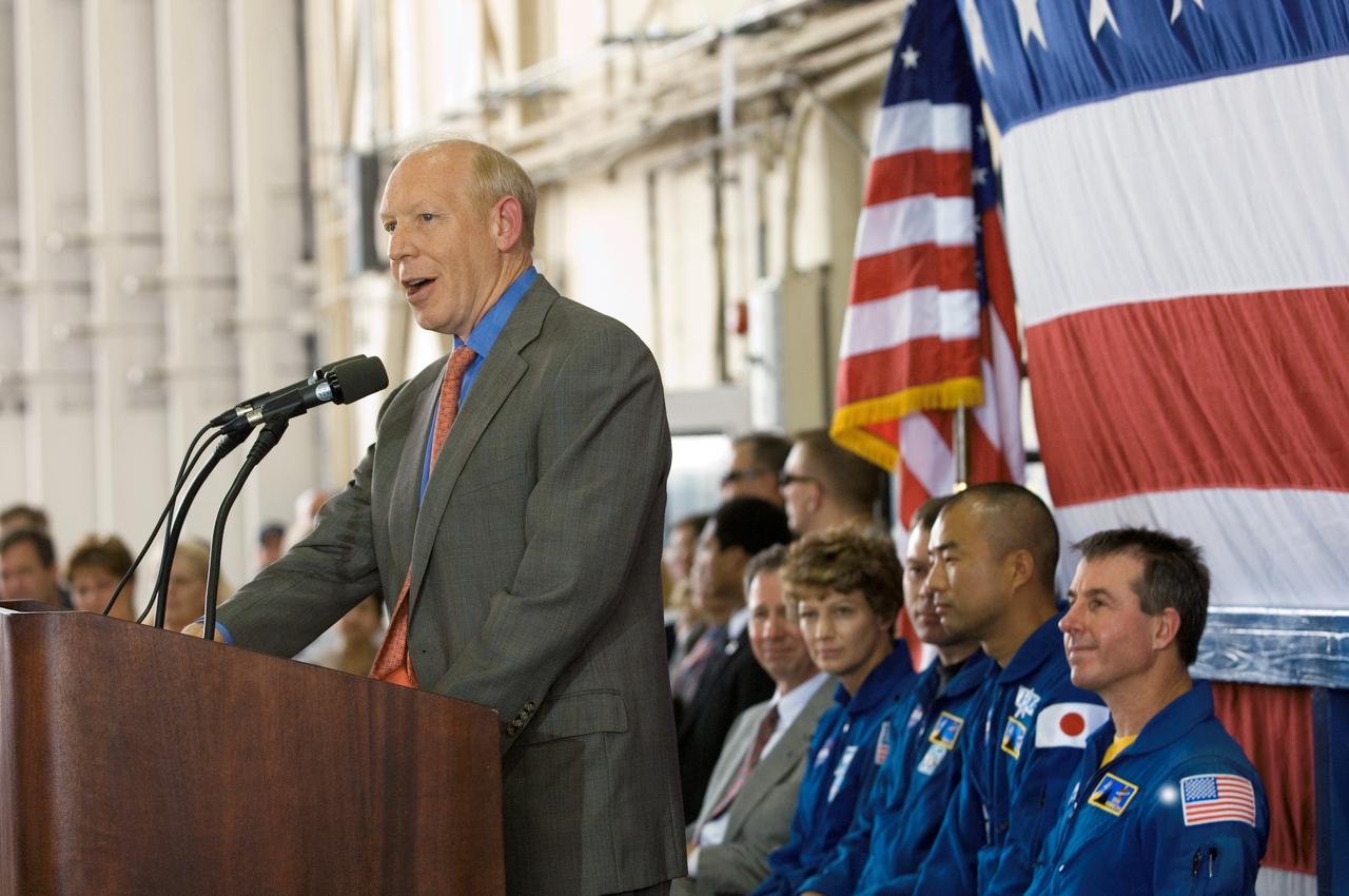 JSC2005-E-33358 (10 August 2005) --- Houston Mayor Bill White speaks to a crowd on hand at Ellington Field&#0146;s Hangar 276 near Johnson Space Center (JSC) during the STS-114 crew return ceremonies. Seated (from the left) are NASA Administrator Michael Griffin; astronauts Eileen M. Collins, commander; James M. Kelly, pilot; Soichi Noguchi, mission specialist representing Japan Aerospace Exploration Agency (JAXA); Stephen K. Robinson, mission specialist. Not pictured are astronauts Andrew S. W. Thomas, Wendy B. Lawrence and Charles J. Camarda, mission specialists.