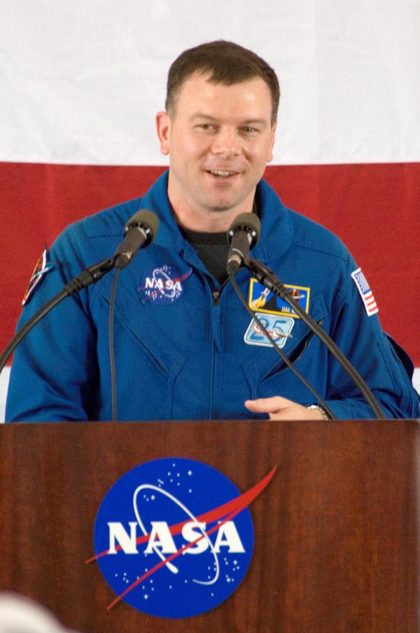 JSC2005-E-33414 (10 August 2005) --- Astronaut James M. Kelly, STS-114 pilot, addresses a crowd on hand at Ellington Field&#0146;s Hangar 276 near Johnson Space Center (JSC) during the STS-114 crew return ceremonies.