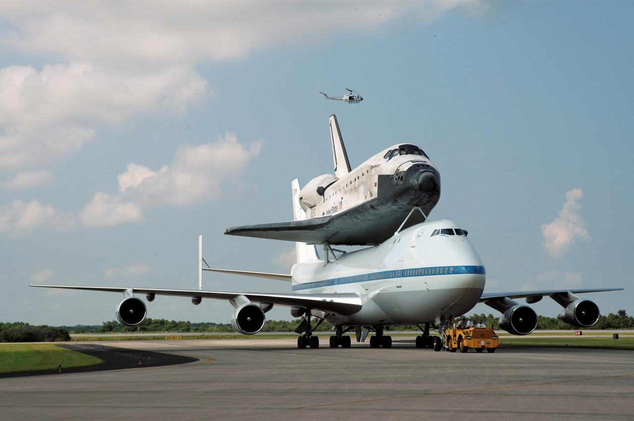 JSC2005-E-36604 (21 August 2005) --- The Space Shuttle Discovery, atop a specially modified Boeing 747, was photographed following touch down at NASA Kennedy Space Center&#0146;s (KSC) Shuttle Landing Facility on Aug. 21, 2005 after a ferry flight from Edwards Air Force Base in California, where the shuttle landed Aug. 9. The 747, known as the Shuttle Carrier Aircraft (SCA), brought Discovery home to KSC after completing the historic STS-114 Return to Flight mission.