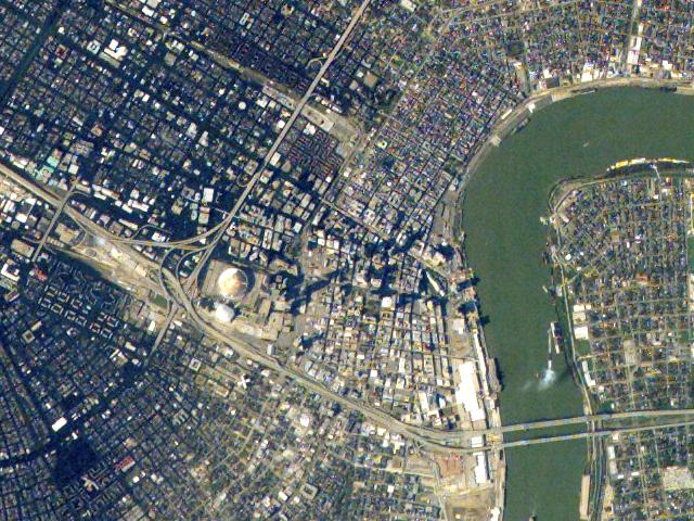JSC2005-E-37988 (8 September 2005) --- This image, acquired on September 8, 2005 from the international space station, depicts flooded areas (dark greenish brown) to the west and southwest of the famous French Quarter (top center). Damage to the roof of the Superdome is clearly visible to the left of image center. The Greater New Orleans Bridge spans the Mississippi River in the lower right corner. North is to top of image, cropped from ISS011-E-12527.