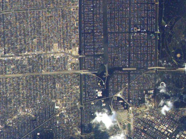 JSC2005e37990 (8 September 2005) ---  Flooding of large sections of I-610 and the I-610/I-10 interchange (center) are visible to the east of the 17th Street Canal in this image acquired on September 8, 2005 from the International Space Station. Flooded regions are dark greenish brown, while dry areas are light brown to tan.   North is to top of image, which was cropped from the digital still camera's original frame, ISS011-E-12527.