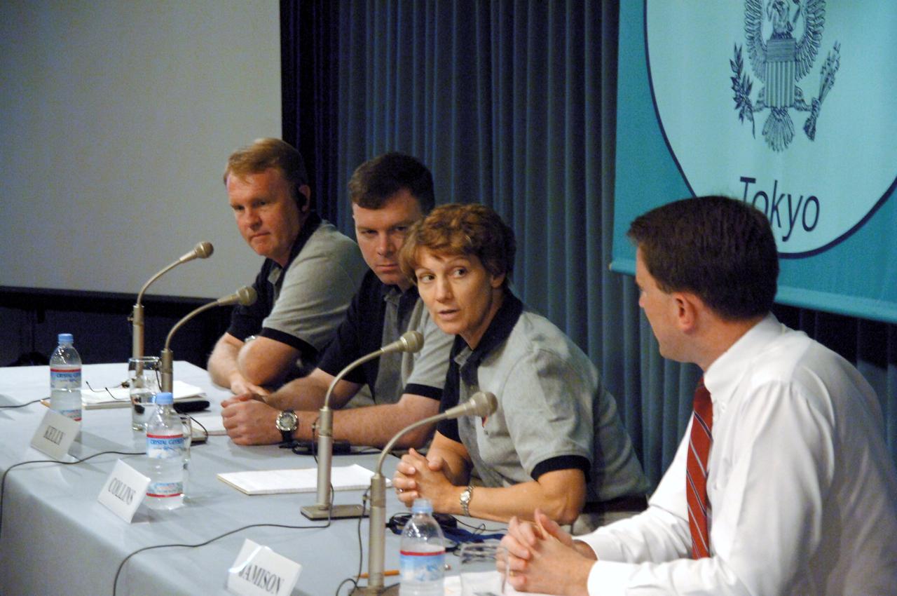 JSC2005-E-40332 (1 October 2005) --- Members of the crew that returned the Space Shuttle to flight earlier this year aboard Discovery, from left, astronauts Andrew S.W. Thomas, Pilot James M. Kelly and Discovery Commander Eileen M. Collins address students at the American Center in Tokyo, Japan, on Oct. 1. The crew visited Japan this week as guests of the Japan Aerospace Exploration Agency (JAXA) and participated in a variety of public events. Photo Credit: Japan Aerospace Exploration Agency