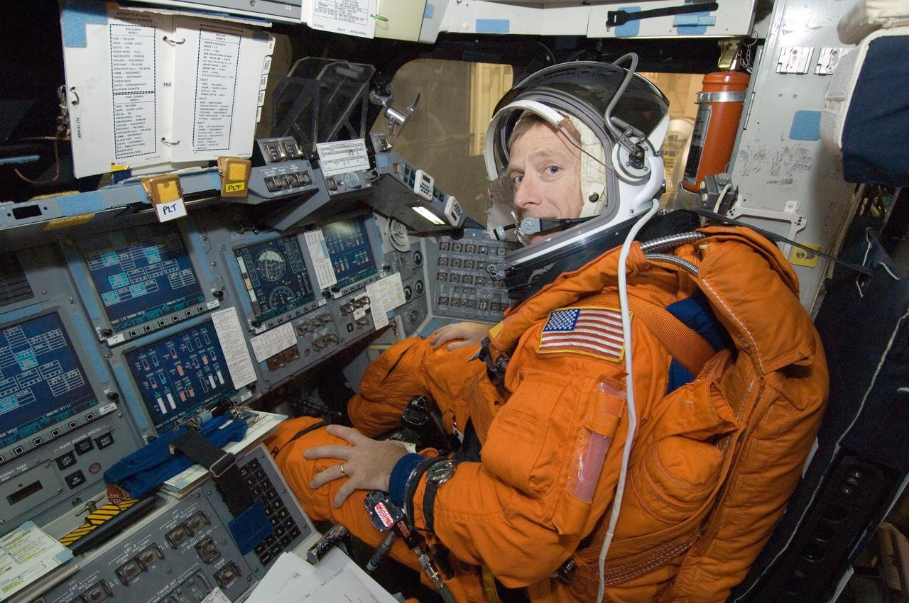 JSC2005-E-47407 (12 Dec. 2005) --- Astronaut Christopher J. Ferguson, STS-115 pilot, attired in a training version of the shuttle launch and entry suit, occupies the pilot&#0146;s station in one of the full-scale trainers during a post insertion training session in the Space Vehicle Mockup Facility at the Johnson Space Center.
