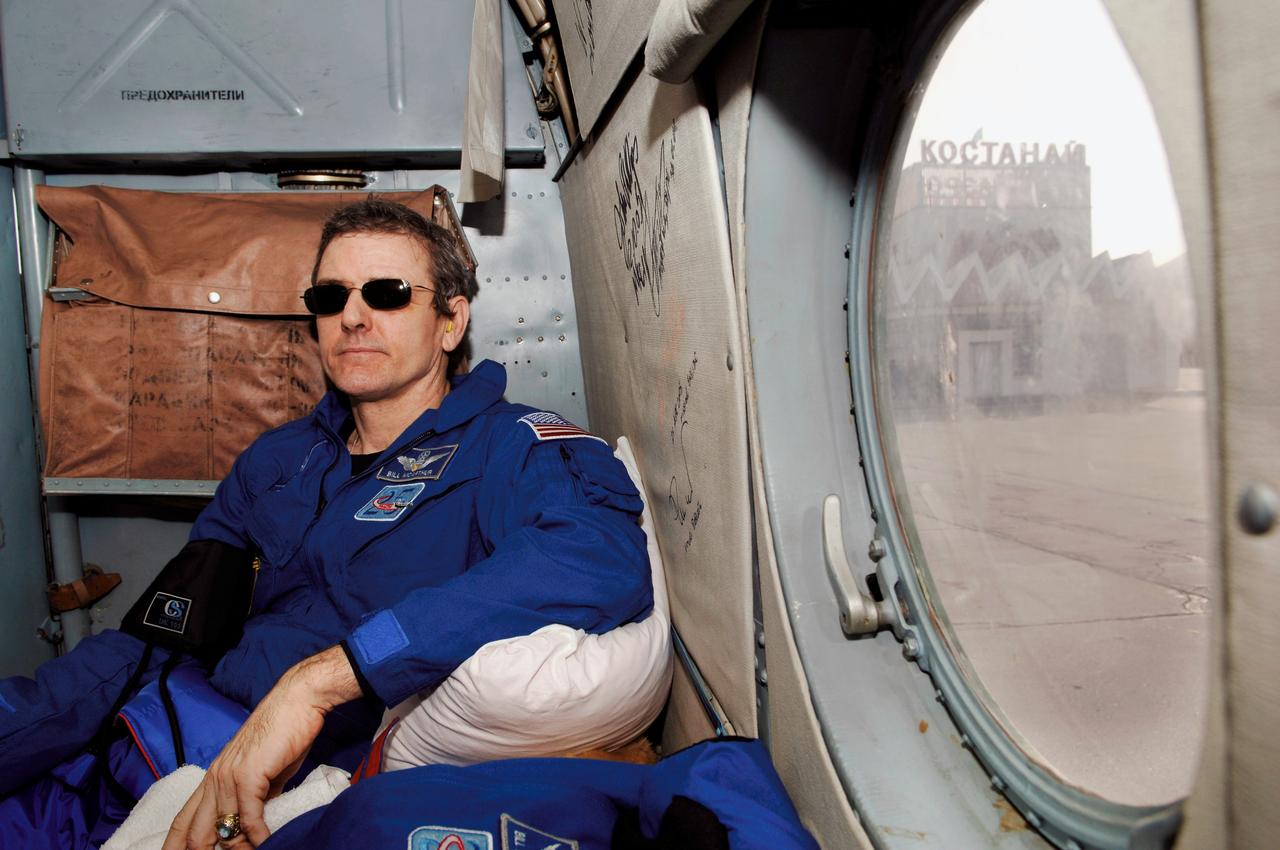 JSC2006-E-13228 (9 April 2006) --- Astronaut William S. McArthur, Jr., NASA Expedition 12 commander and International Space Station science officer, waits onboard a helicopter before transferring to an airplane for a flight back to Moscow from Kustanay, Kazakhstan. The Expedition 12 crew and astronaut Marcos Pontes, Brazilian Space Agency participant, returned to earth on the Soyuz TMA-7 spacecraft and landed in the steppes of Kazakhstan on April 9, 2006. Returning on the spacecraft along with McArthur and Pontes was cosmonaut Valery I. Tokarev, Russia’s Federal Space Agency flight engineer and Soyuz commander. Pontes arrived at the station with the Expedition 13 crew on April 1. Photo Credit: NASA/Bill Ingalls