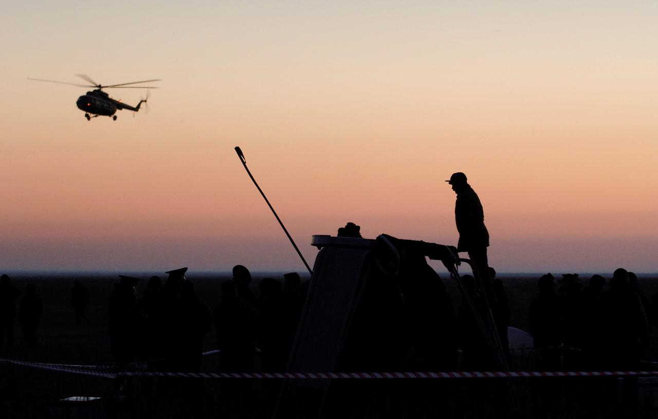 JSC2006-E-16029 (9 April 2006) --- A Russian search and rescue helicopter flies over Arkalyk airport, Kazakhstan. Astronaut William S. (Bill) McArthur, Jr., Expedition 12 commander and NASA space station science officer; cosmonaut Valery I. Tokarev, flight engineer and Soyuz commander representing Russia's Federal Space Agency; and Brazilian astronaut Marco C. Pontes brought their Soyuz TMA-7 capsule to a pre-dawn landing on April 9, 2006 (Kazakhstan time). McArthur and Tokarev completed six months in space on the station, while Pontes spent 10 days in orbit. Photo Credit: NASA/Victor Zelentsov