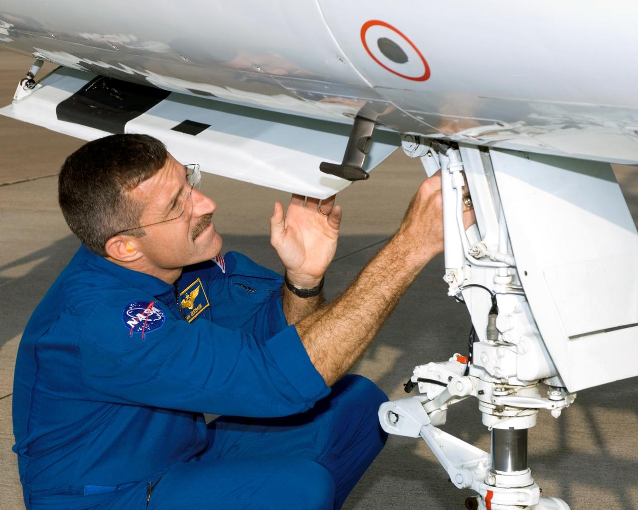 JSC2006-E-27870 (22 June 2006) --- Astronaut Daniel C. Burbank, STS-115 mission specialist, prepares for a flight in a NASA T-38 trainer jet at Ellington Field near Johnson Space Center.