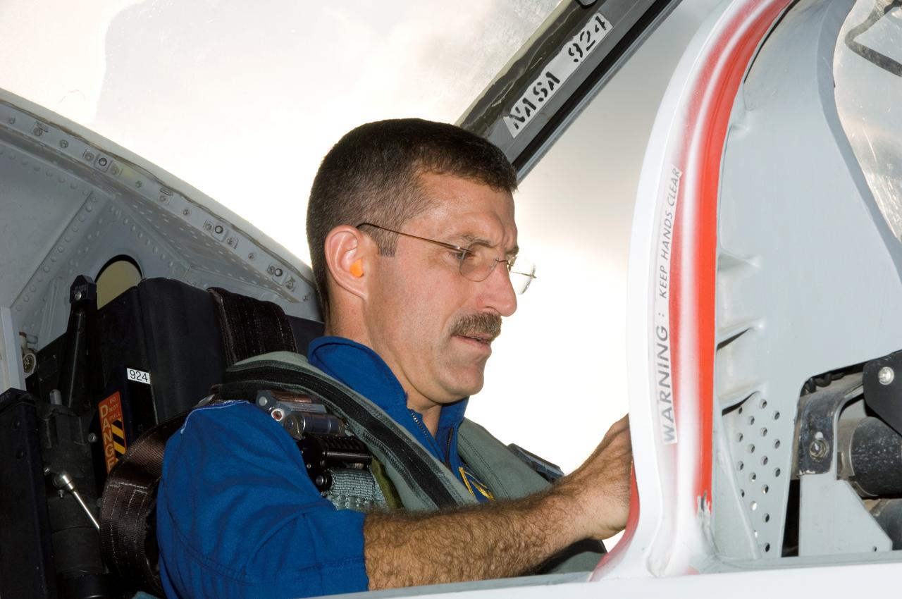 JSC2006-E-27877 (22 June 2006) --- Astronaut Daniel C. Burbank, STS-115 mission specialist, photographed in a T-38 trainer jet, prepares for a flight at Ellington Field near Johnson Space Center.
