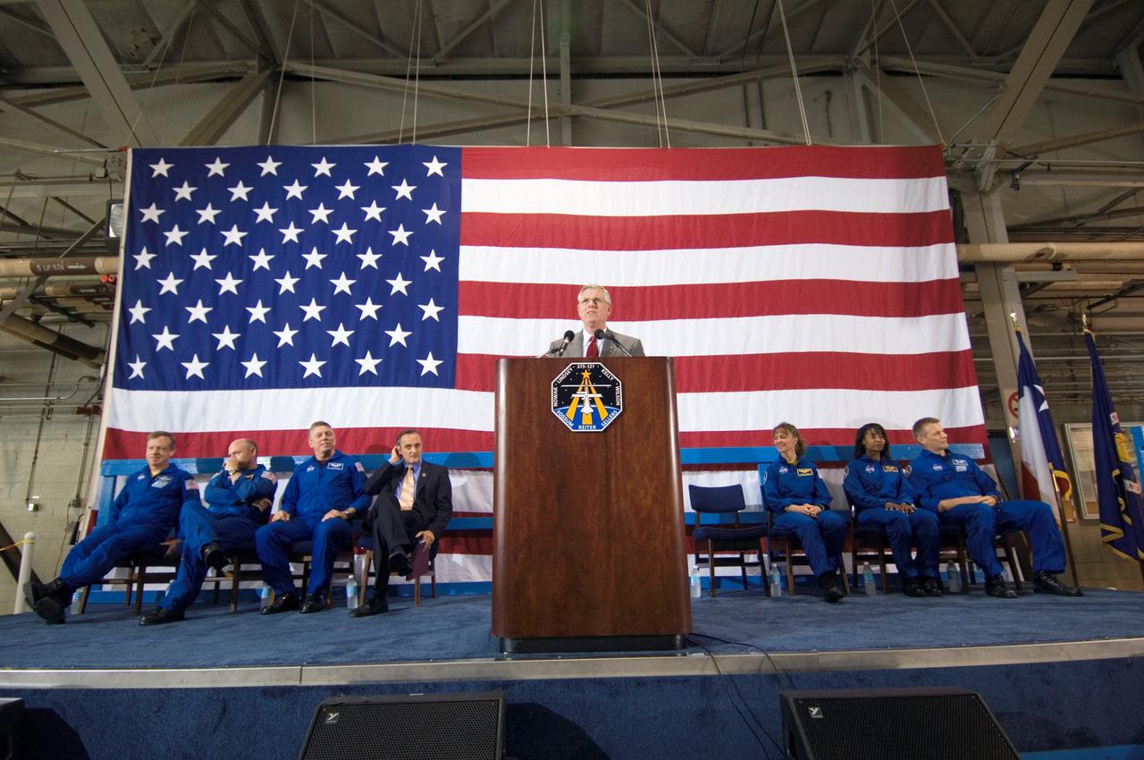 JSC2006-E-28428 (18 July 2006) --- Johnson Space Center's (JSC) director Michael L. Coats speaks from a lectern in Ellington Field's Hangar 276 near JSC during the STS-121 crew return ceremonies. Seated from the left are astronauts Steven W. Lindsey, commander; Mark E. Kelly, pilot; Michael E. Fossum, mission specialist; NASA associate administrator Rex Geveden; astronauts Lisa M. Nowak, Stephanie D. Wilson and Piers J. Sellers, mission specialists. Photo credit: NASA