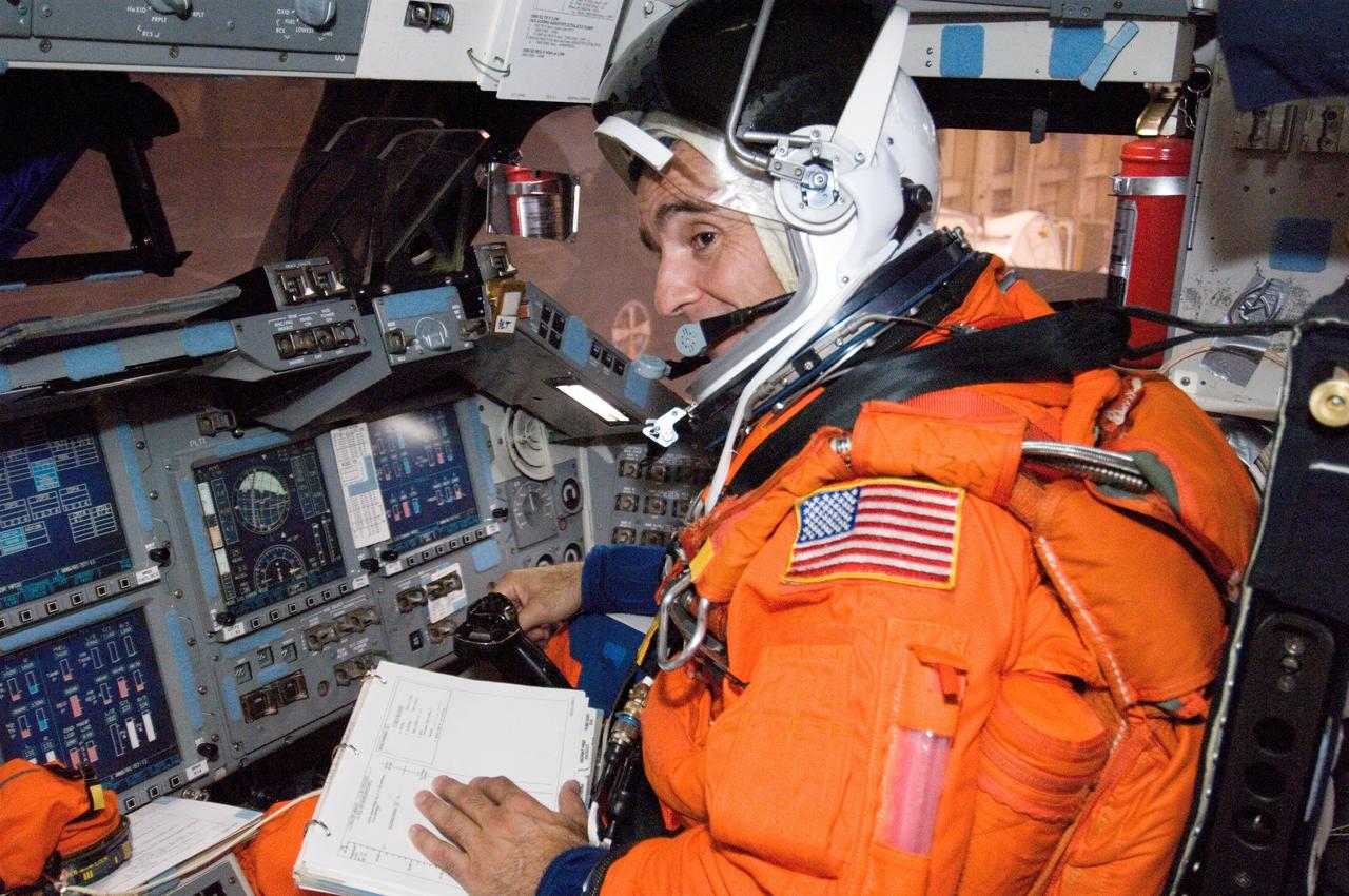 JSC2006-E-32656 (3 Aug. 2006) --- While seated at the pilot's station, astronaut Lee J. Archambault, STS-117 pilot, participates in a training session in the crew compartment trainer (CCT-2) in the Space Vehicle Mockup Facility at Johnson Space Center. Archambault is wearing a training version of his shuttle launch and landing suit.