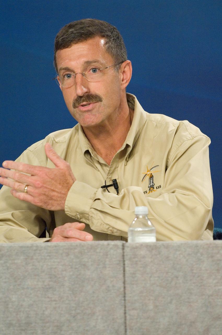 JSC2006-E-34265 (11 Aug. 2006) --- Astronaut Daniel C. Burbank, STS-115 mission specialist, responds to a question from the media during a pre-flight press conference at Johnson Space Center.