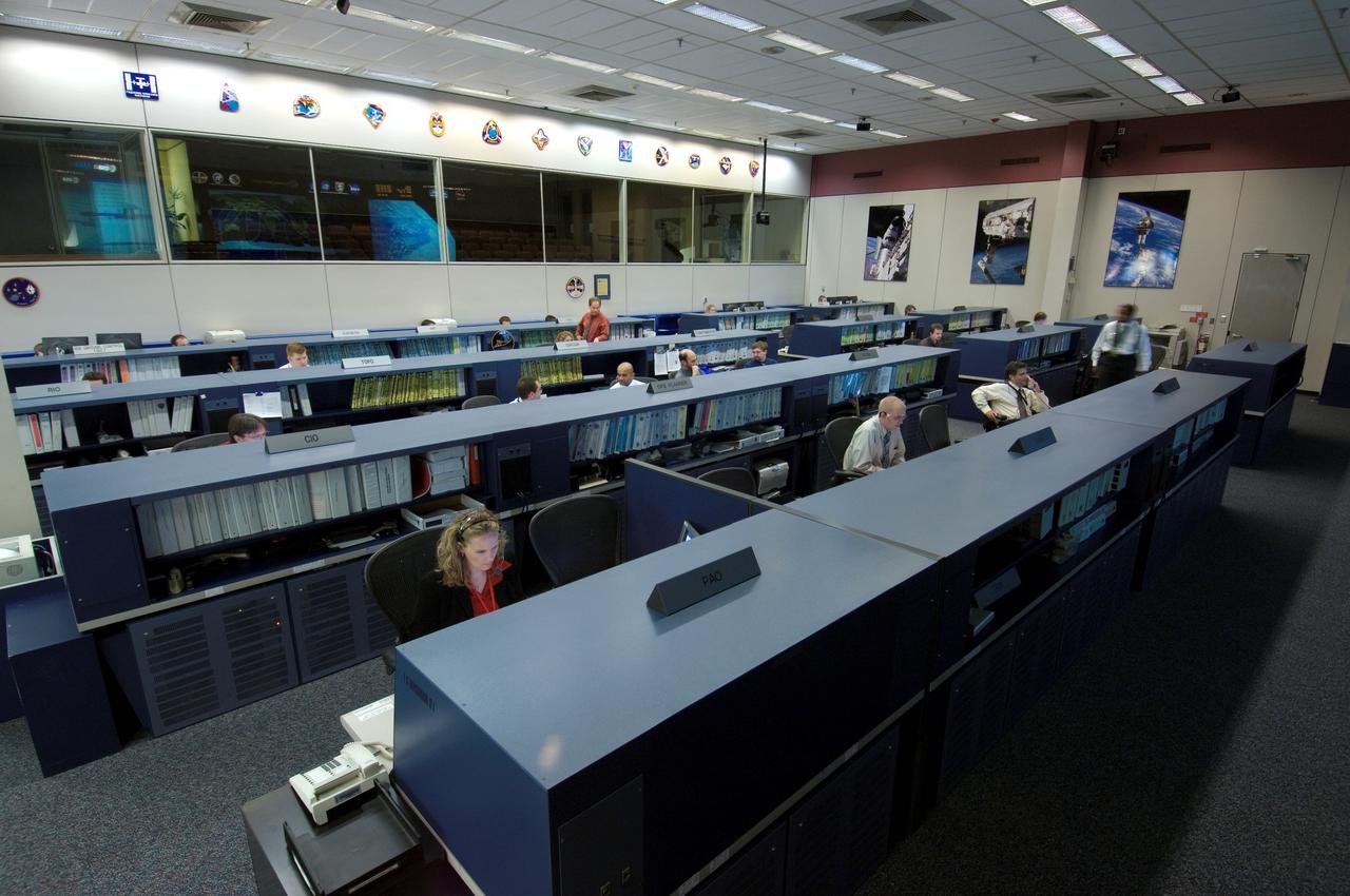 JSC2006-E-43863 (6 Oct. 2006)--- International Space Station flight controllers have this area as their new home with increased technical capabilities, more workspace and a long, distinguished history. The newly updated facility is just down the hall from its predecessor at NASA's Johnson Space Center, Houston. This view is toward the rear of the "new" room.  Known as Flight Control Room 1, it was first used to control a space flight 38 years ago, the mission of Apollo 7 launched Oct. 11, 1968. It was one of two control rooms for NASA's manned missions. The room it replaces in its new ISS role, designated the Blue Flight Control Room, had been in operation since the first station component was launched in 1998.