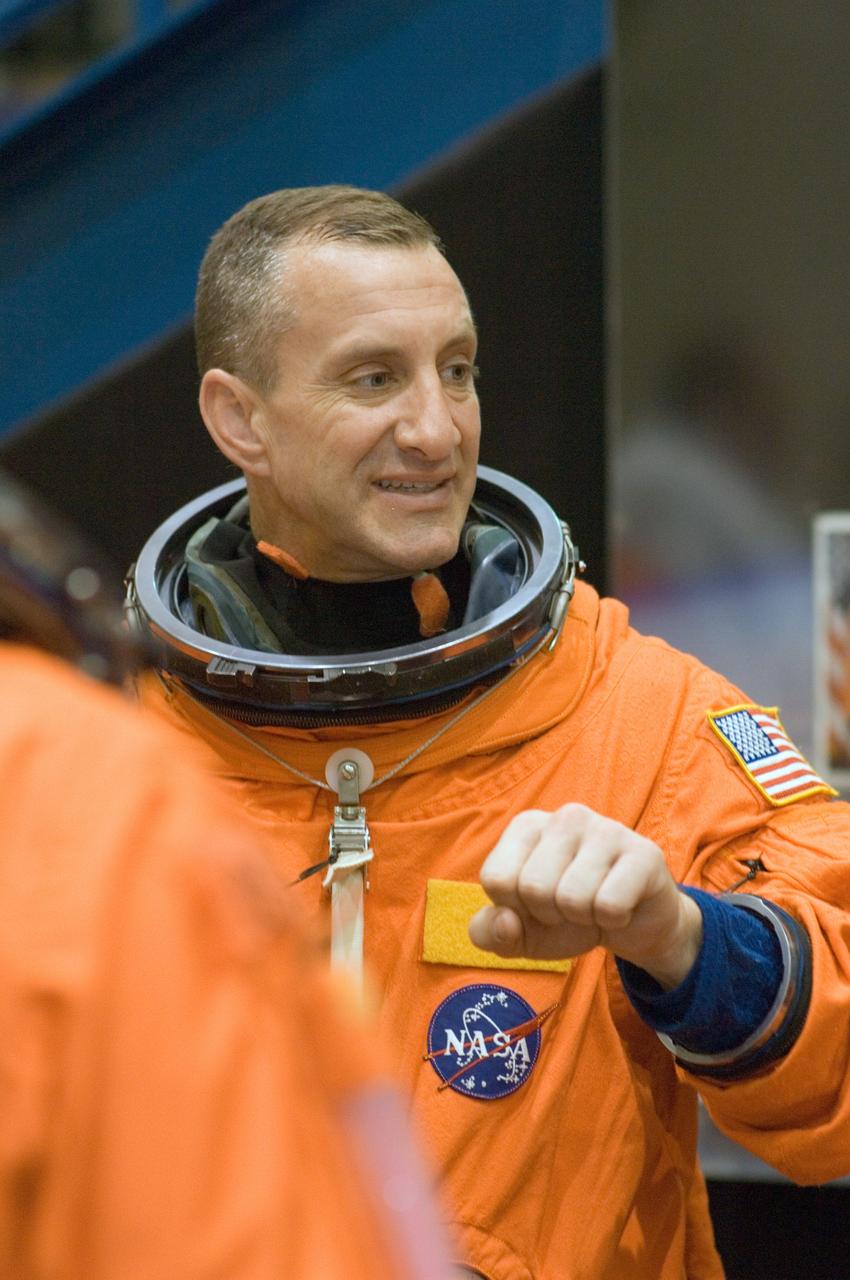 JSC2006-E-45243 (18 Oct. 2006) --- Attired in a training version of his shuttle launch and entry suit, astronaut Charles O. Hobaugh, STS-118 pilot, awaits the start of a mission training session in the Space Vehicle Mockup Facility at Johnson Space Center.