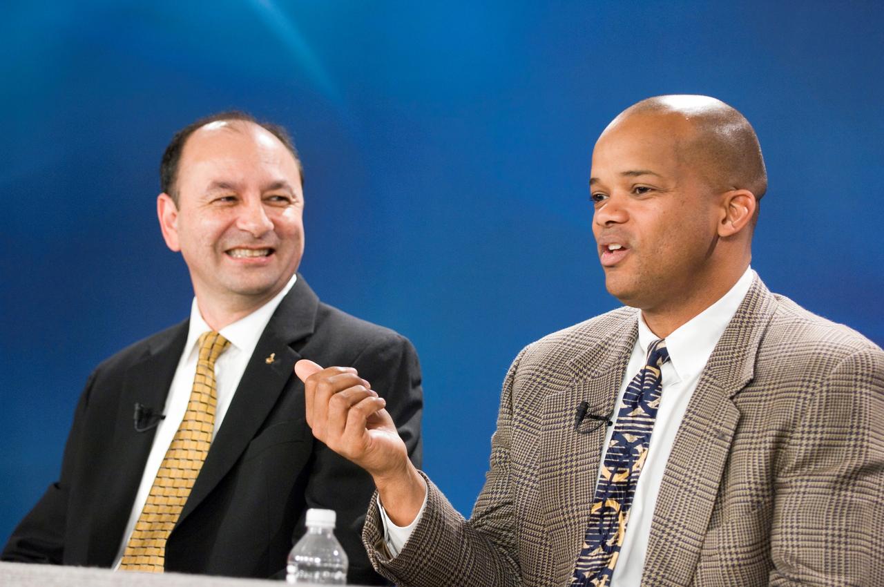 JSC2006-E-47958 (6 November 2006) --- Astronauts Mark L. Polansky, left, and Robert L. Curbeam Jr. respond to a question from a reporter during a Nov. 6 press briefing at the Johnson Space Center. Polansky, commander, and Curbeam, one of five mission specialists, are part of the seven-member STS-116 crew currently in training for a Dec. 2006 visit to the International Space Station.