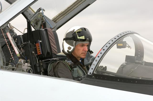 NASA image: STS-117 crew members Frederick Sturckow and Lee Archambault leaving in T-38