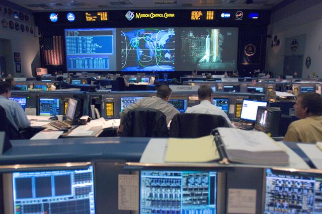 NASA image: STS-116 Flight Controllers on console during mission - (Ascent/Entry Shift)