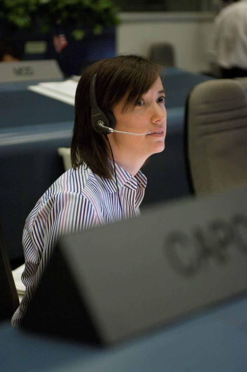 JSC2006-E-54743 (20 Dec. 2006) --- Astronaut K. Megan McArthur, STS-116 Orbit 2 spacecraft communicator (CAPCOM), talks with the astronauts aboard the Space Shuttle Discovery as they wind down toward the final 48 hours of an almost two-week mission in space.