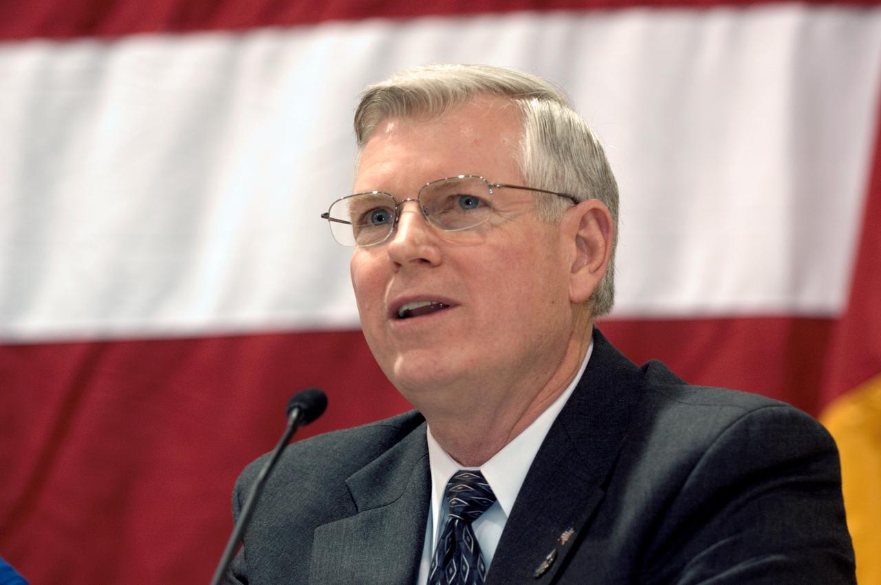 JSC2006-E-54858 (23 Dec. 2006) --- Michael L. Coats, director of the Johnson Space Center, addresses a large turnout of well-wishers at the STS-116 crew return ceremony on the afternoon of Dec. 23 at Ellington Field. Coats congratulated and thanked the Space Shuttle Discovery astronauts, whose work on the International Space Station represented one of the most difficult mission tasks in NASA's history. Seated not far away from Coats on the stage were the seven astronauts who returned to Earth on Dec. 22 aboard the Discovery. They spent their first night back on Earth in Florida, near their Kennedy Space Center landing site.