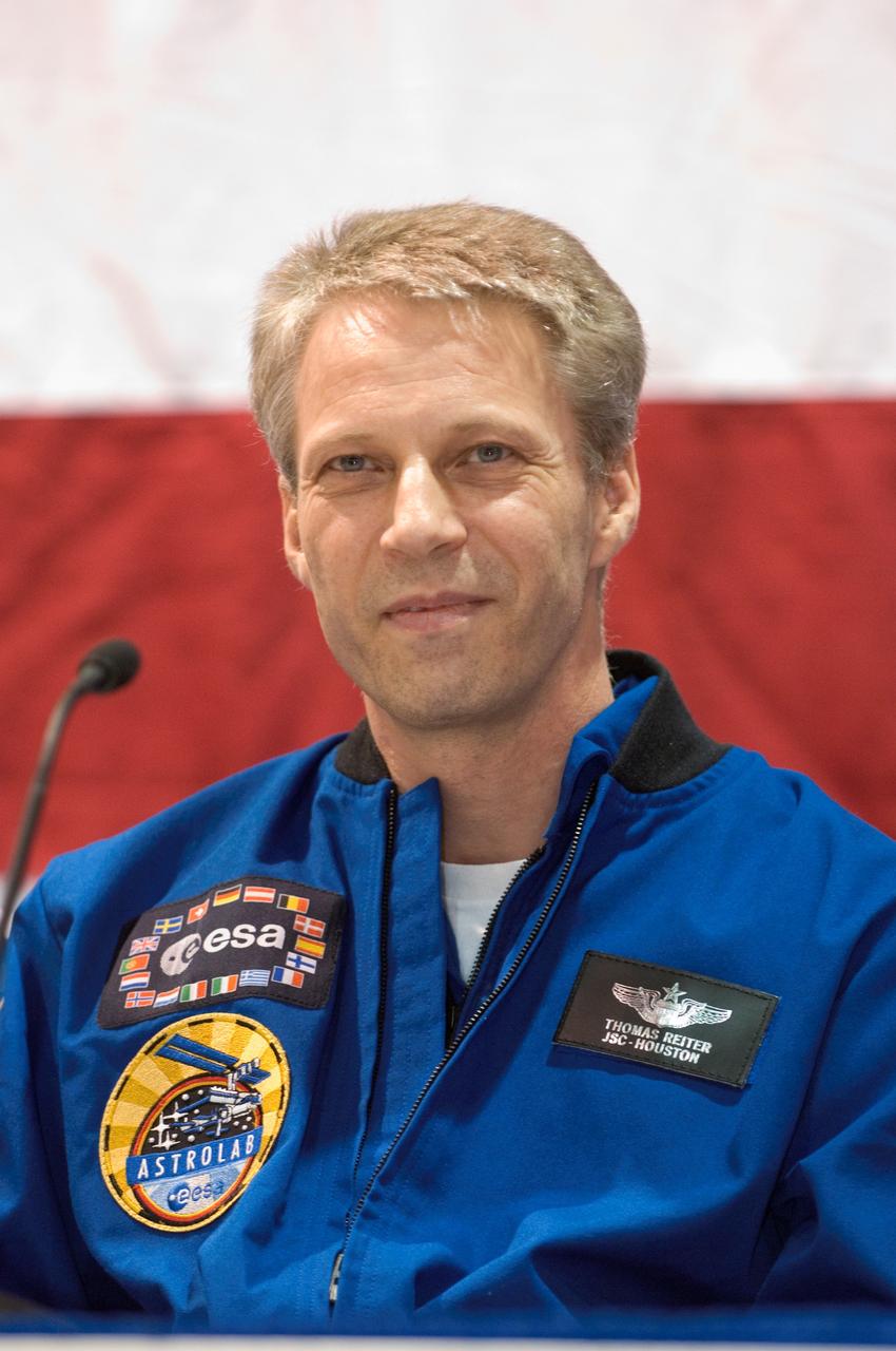 JSC2006-E-54869 (23 Dec. 2006) --- European Space Agency astronaut Thomas Reiter, STS-116 mission specialist, speaks to a crowd of well-wishers at the STS-116 crew return ceremony on the afternoon of Dec. 23 at Ellington Field. Reiter didn't launch with the STS-116 crew, as he had already been onboard the International Space Station for several months when Discovery arrived to link up with it on Dec. 11. Reiter and all six of his crewmates briefly addressed the crowd.