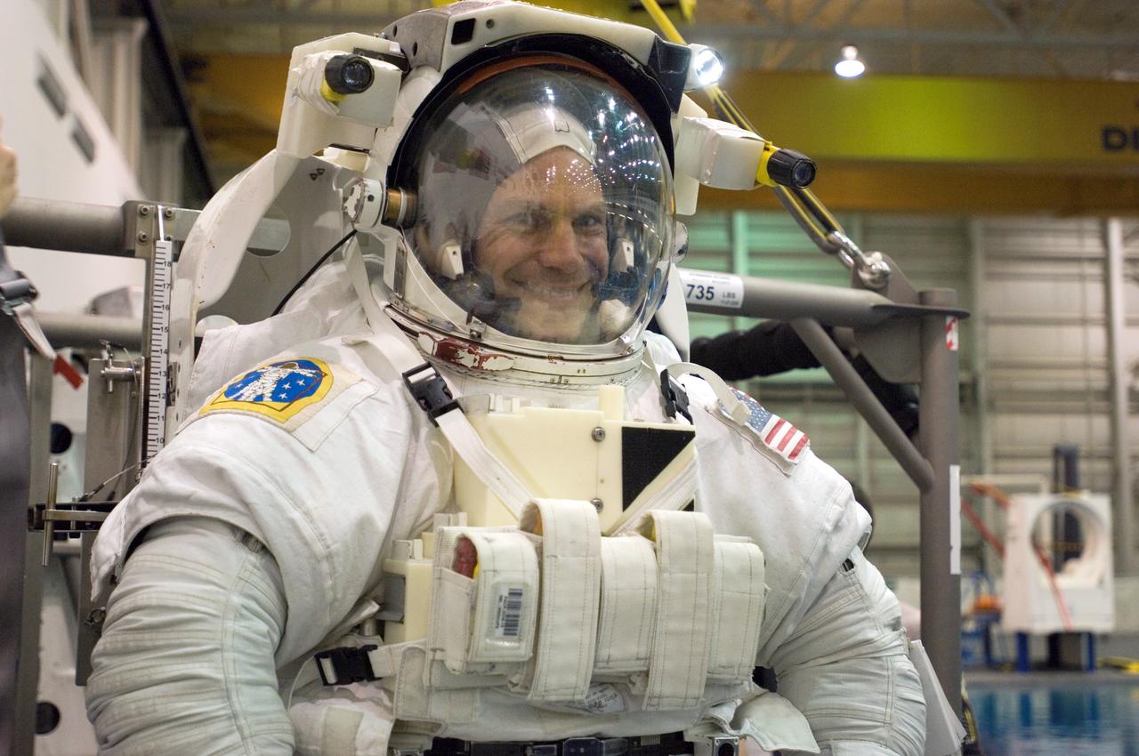 JSC2007-E-27733 (6 June 2007) --- Astronaut Stanley G. Love, STS-122 mission specialist, attired in a training version of the Extravehicular Mobility Unit (EMU) spacesuit, awaits the start of a training session in the waters of the Neutral Buoyancy Laboratory (NBL) near the Johnson Space Center.