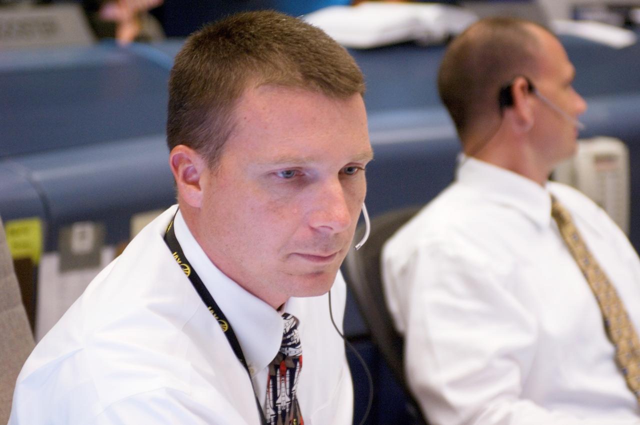 JSC2007-E-28291 (8 June 2007) --- In the space shuttle flight control room of Johnson Space Center's Mission Control Center (MCC), astronauts Terry W. Virts Jr. (foreground) and Dominic A. (Tony) Antonelli, spacecraft communicators (CAPCOM), monitor launch countdown activities a few hundred miles away in Florida, site of Space Shuttle Atlantis' scheduled STS-117 launch. Liftoff occurred at 7:38 p.m. (EDT) on June 8, 2007 from launch pad 39A at Kennedy Space Center.